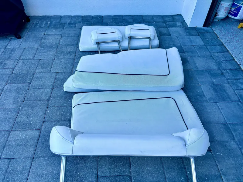 Slide: The Image of Cushions from a 2017 Sea Hunt Gamefish 27 boat on a tiled floor. - 15
