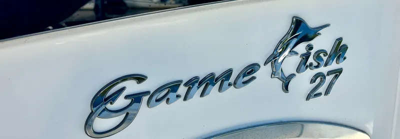 Slide: The Image of 2017 Sea Hunt Gamefish 27 logo on boat hull. - 6