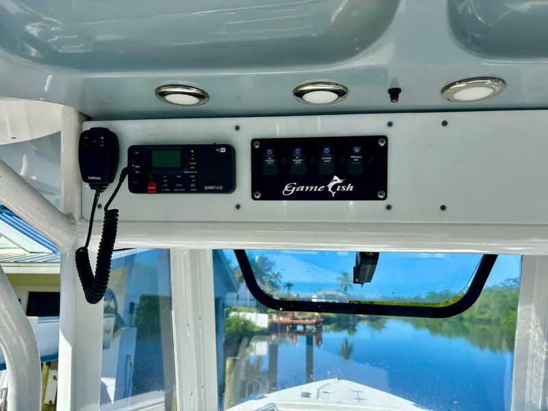 Slide: The Image of 2017 Sea Hunt Gamefish 27 boat console with radio and control panel. - 9