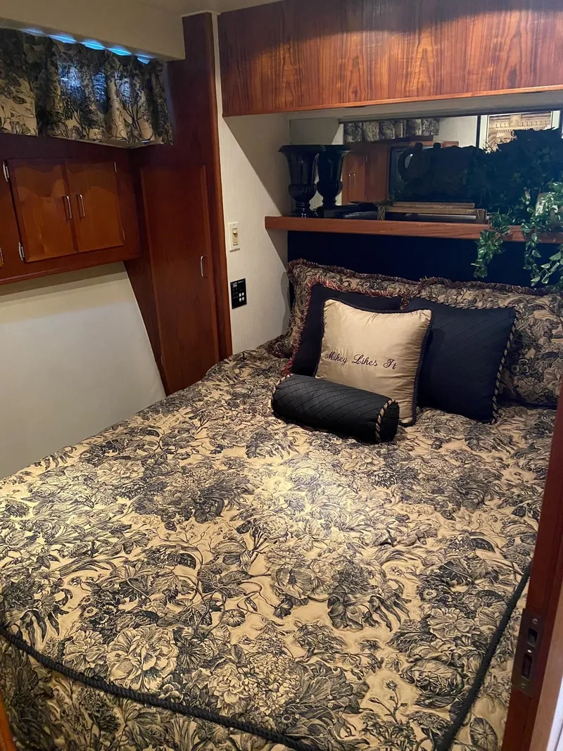 Slide: The Image of Cozy bedroom in 1992 Henriques 50 Sportfisherman with floral bedding and wooden cabinetry. - 18