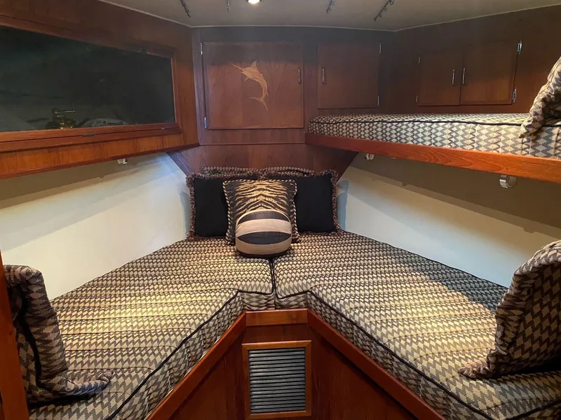 Slide: The Image of Cozy cabin interior of 1992 Henriques 50 Sportfisherman with patterned bedding and wood accents. - 20