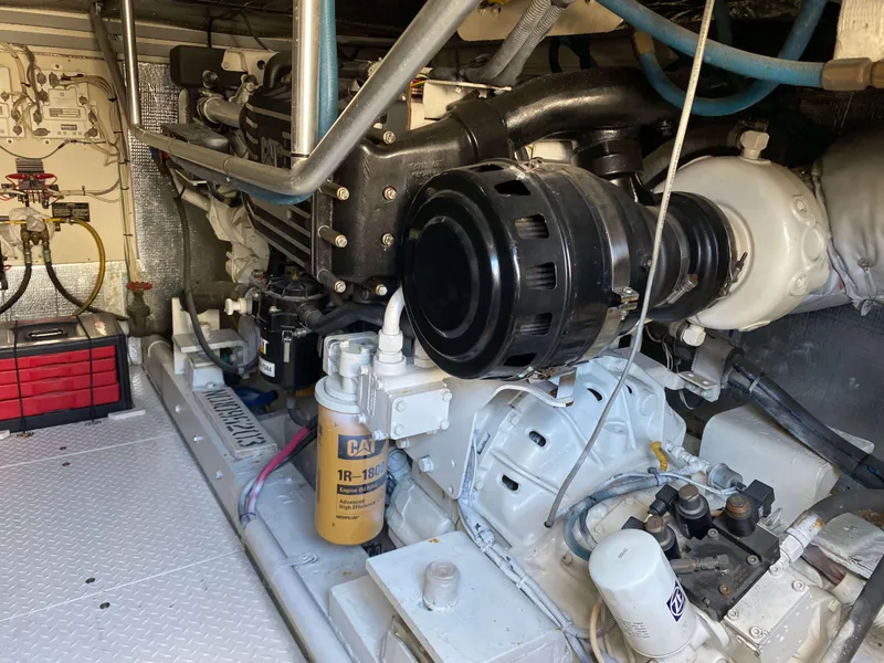 Slide: The Image of Engine room of 1992 Henriques 50 Sportfisherman with visible components and wiring. - 24