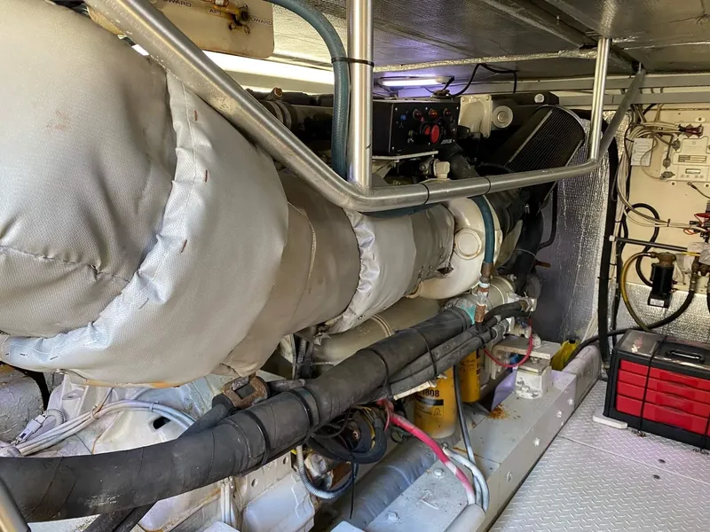 Slide: The Image of Engine room of 1992 Henriques 50 Sportfisherman with visible machinery and components. - 25