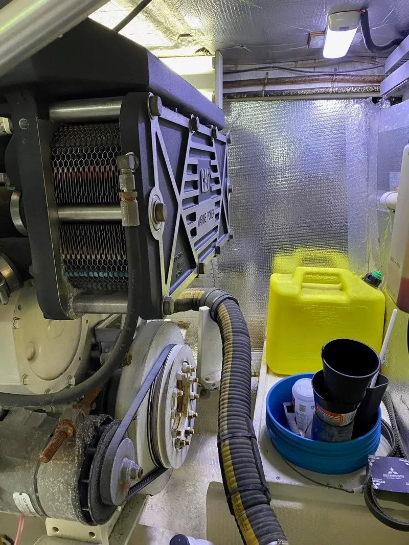 Slide: The Image of Engine room of 1992 Henriques 50 Sportfisherman with equipment and storage items. - 26