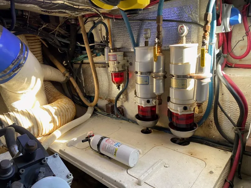 Slide: The Image of Engine room of 1992 Henriques 50 Sportfisherman with fuel filters and fire extinguisher. - 31