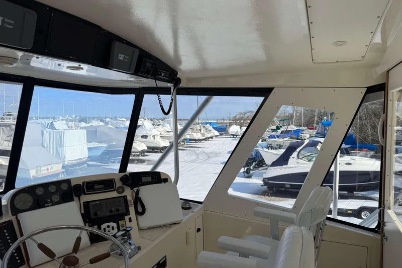 Slide: The Image of Interior view of 1992 Henriques 50 Sportfisherman, overlooking a snowy marina with boats. - 36