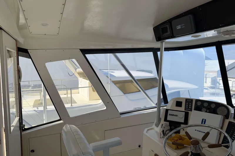 Slide: The Image of Interior view of 1992 Henriques 50 Sportfisherman yacht cockpit with navigation equipment. - 37