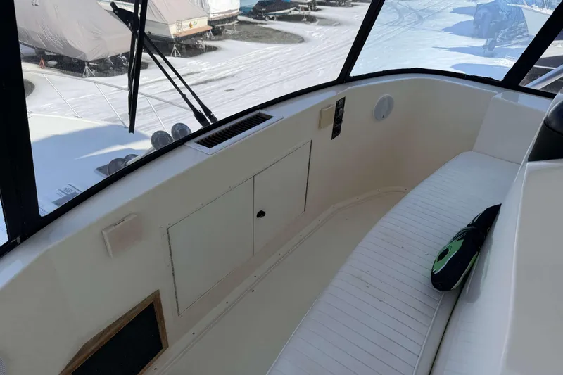 Slide: The Image of 1992 Henriques 50 Sportfisherman boat interior with seating and storage compartments. - 39