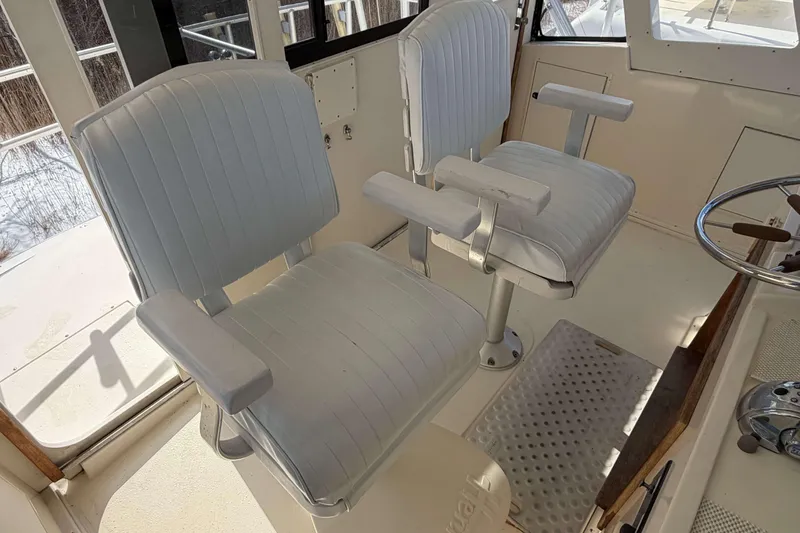 Slide: The Image of Interior of 1992 Henriques 50 Sportfisherman with two white captain's chairs. - 42