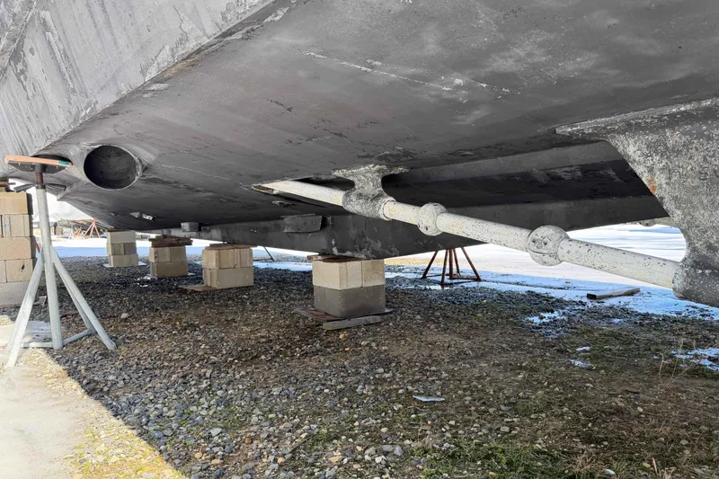 Slide: The Image of 1992 Henriques 50 Sportfisherman boat hull on blocks, under maintenance. - 47