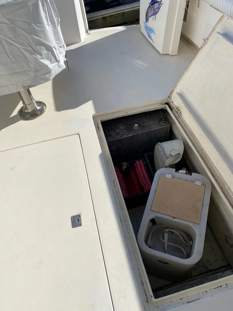 Slide: The Image of Open storage compartment on 1992 Henriques 50 Sportfisherman boat deck. - 6