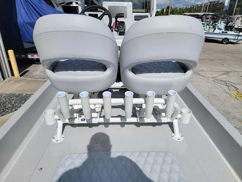 Slide: The Image of 2025 SCB R24 boat with dual seats and multiple rod holders. - 14