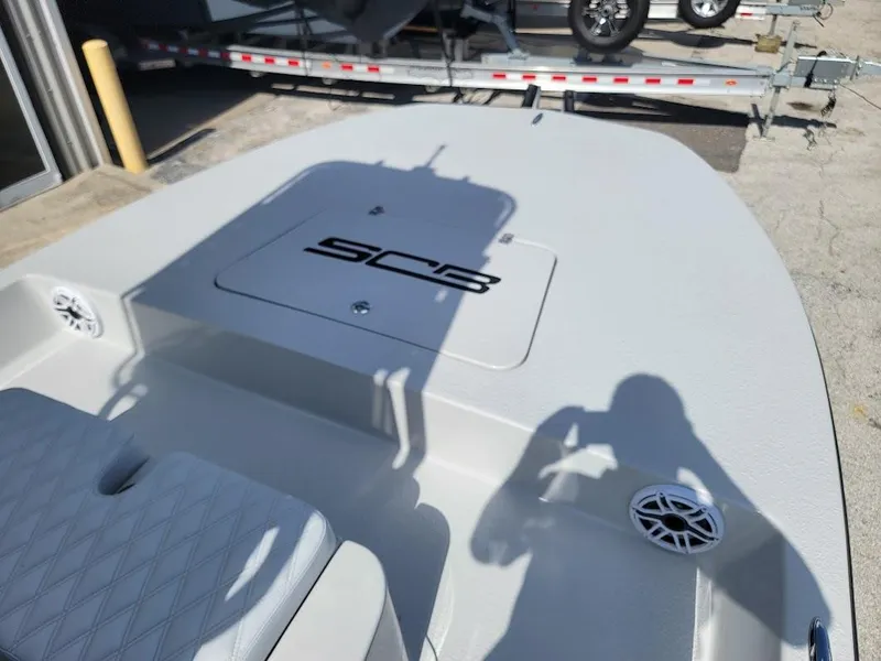 Slide: The Image of 2025 SCB R24 boat deck with seating and storage, featuring sleek design and modern amenities. - 16