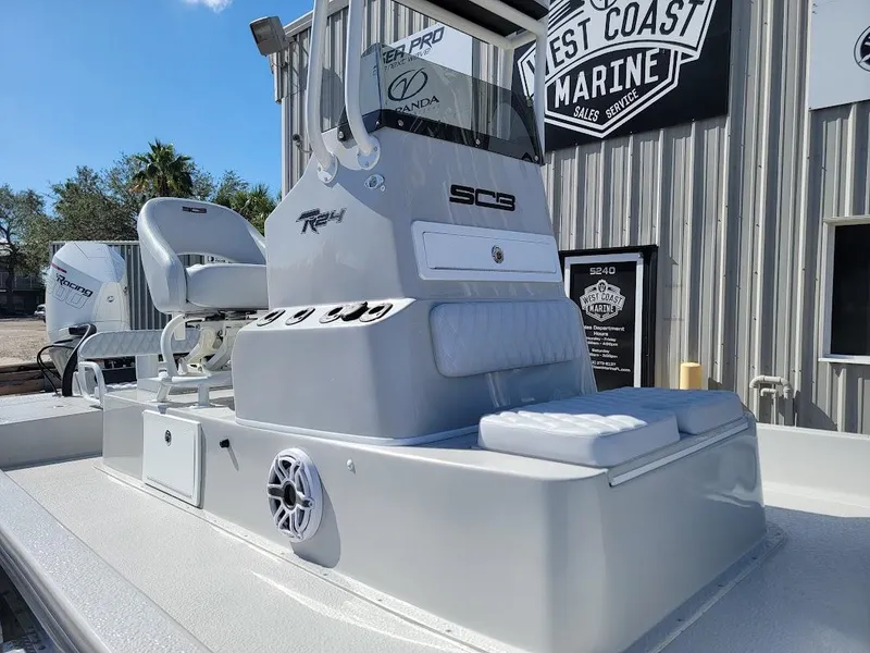 Slide: The Image of 2025 SCB R24 boat at West Coast Marine, featuring sleek design and modern controls. - 3