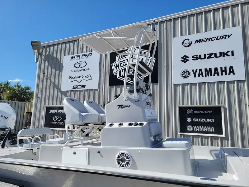 Slide: The Image of 2025 SCB R24 boat displayed at dealership with brand logos in background. - 4