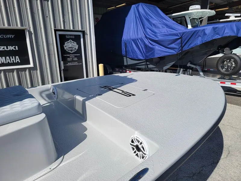 Slide: The Image of 2025 SCB R24 boat at dealership, featuring sleek design and modern detailing. - 5