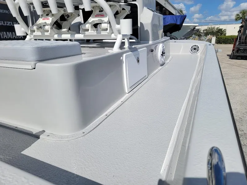 Slide: The Image of 2025 SCB R24 boat deck with rod holders and storage compartments. - 9