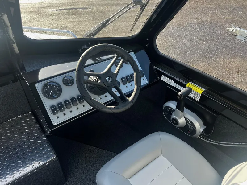 Slide: The Image of 2025 Thunder Jet 185 Luxor boat cockpit with steering wheel and control panel. - 10