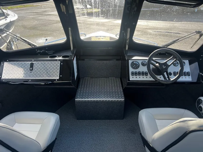 Slide: The Image of Interior of 2025 Thunder Jet 185 Luxor boat with modern dashboard and seating. - 12