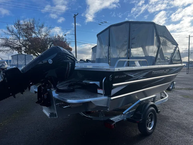 Slide: The Image of 2025 Thunder Jet 185 Luxor boat with canopy and outboard motor on trailer. - 3