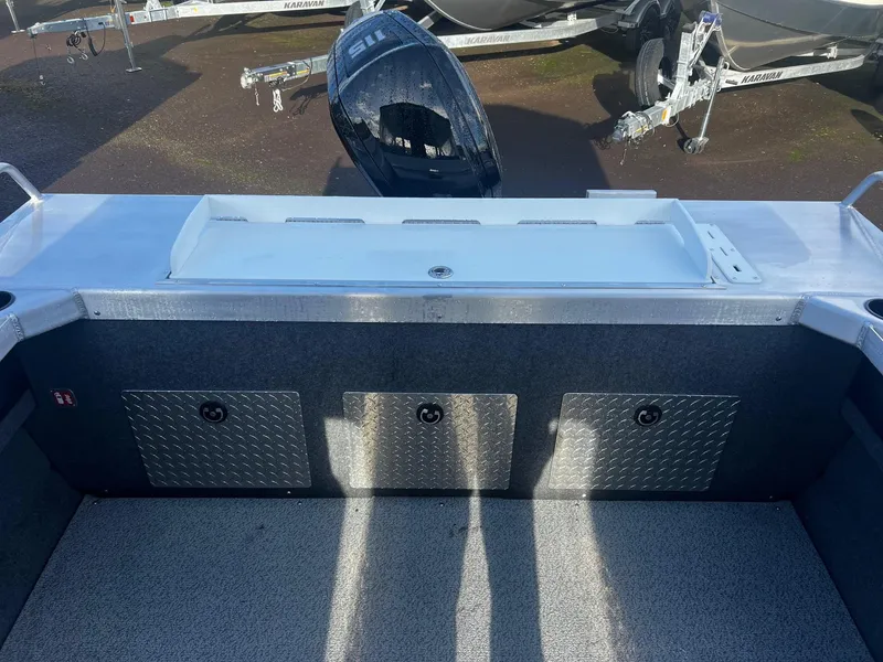 Slide: The Image of 2025 Thunder Jet 185 Luxor boat interior with storage compartments and motor. - 5