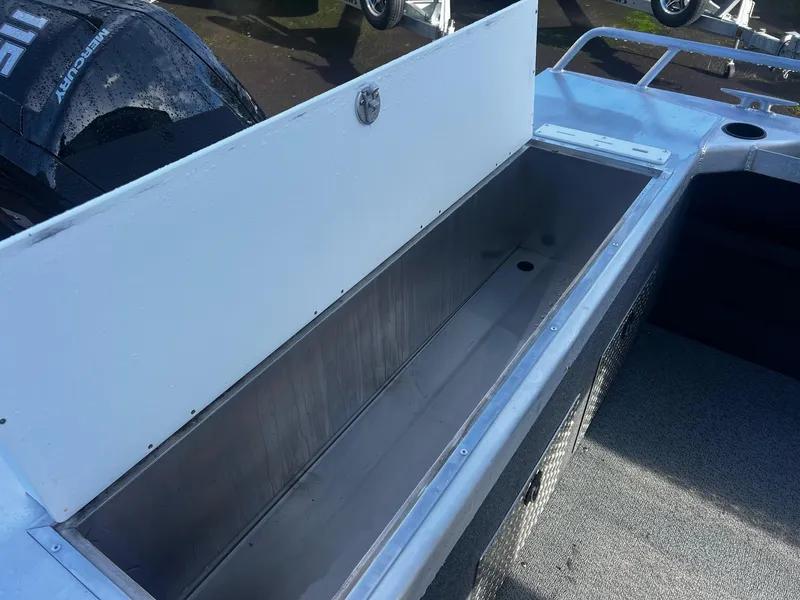 Slide: The Image of 2025 Thunder Jet 185 Luxor boat storage compartment with open lid. - 6
