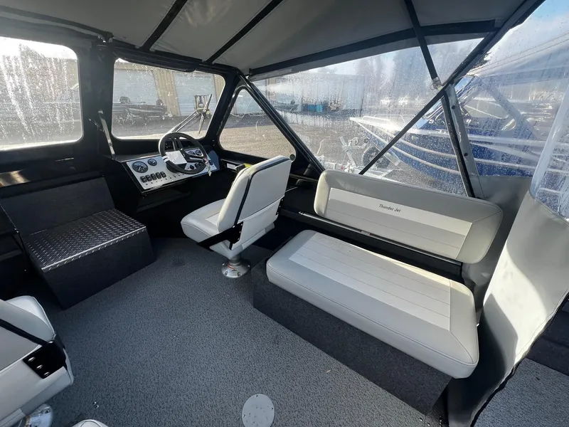 Slide: The Image of 2025 Thunder Jet 185 Luxor boat interior with seating and steering console. - 9