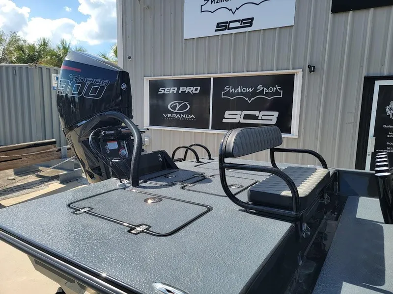 Slide: The Image of 2025 SCB S22 boat with powerful engine and seating, displayed outdoors. - 10