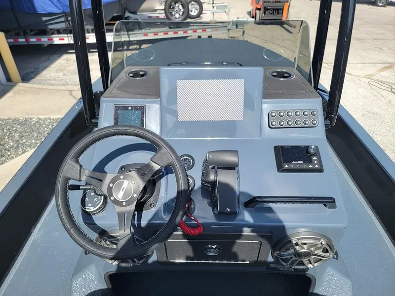 Slide: The Image of 2025 SCB S22 boat dashboard with steering wheel and control panel. - 17