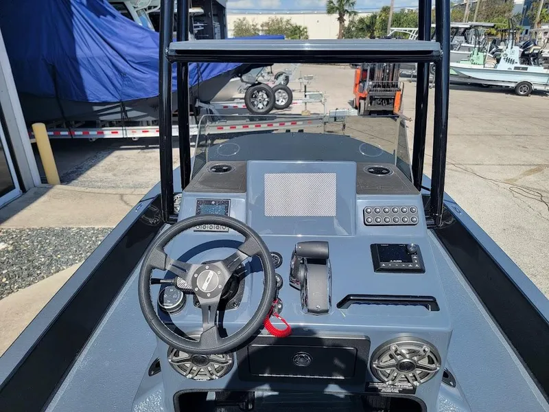 Slide: The Image of 2025 SCB S22 boat dashboard with steering wheel and control panel. - 18