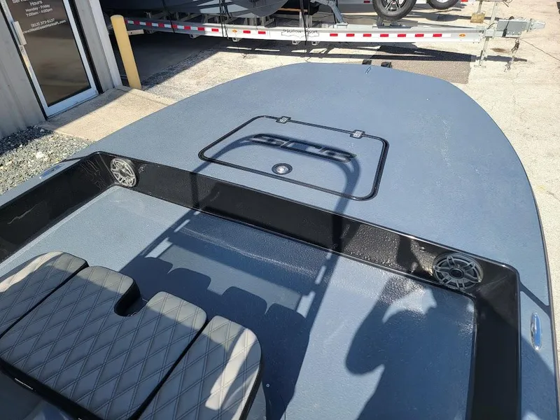 Slide: The Image of 2025 SCB S22 boat deck with seating and storage hatch. - 22