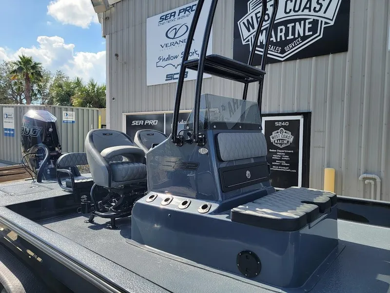 Slide: The Image of 2025 SCB S22 boat at West Coast Marine dealership, featuring modern seating and controls. - 3