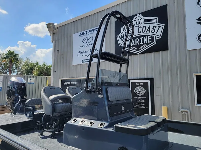 Slide: The Image of 2025 SCB S22 boat at West Coast Marine dealership, sunny day. - 4