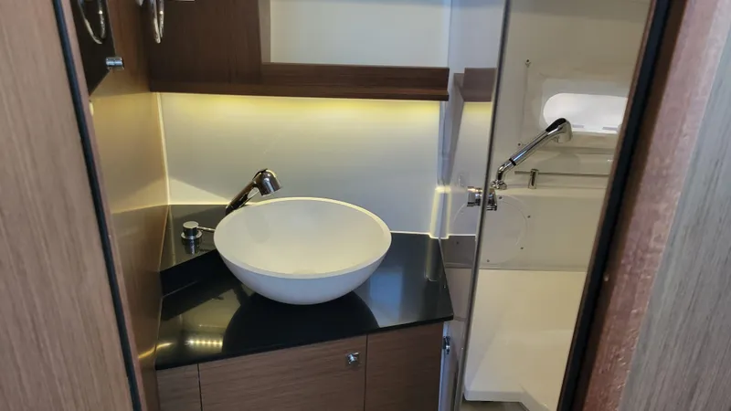 Slide: The Image of 2023 Jeanneau LEADER 9.0WA bathroom with modern sink and sleek design. - 16