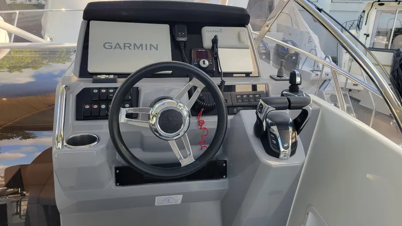 Slide: The Image of 2023 Jeanneau LEADER 9.0WA boat helm with Garmin navigation system. - 6
