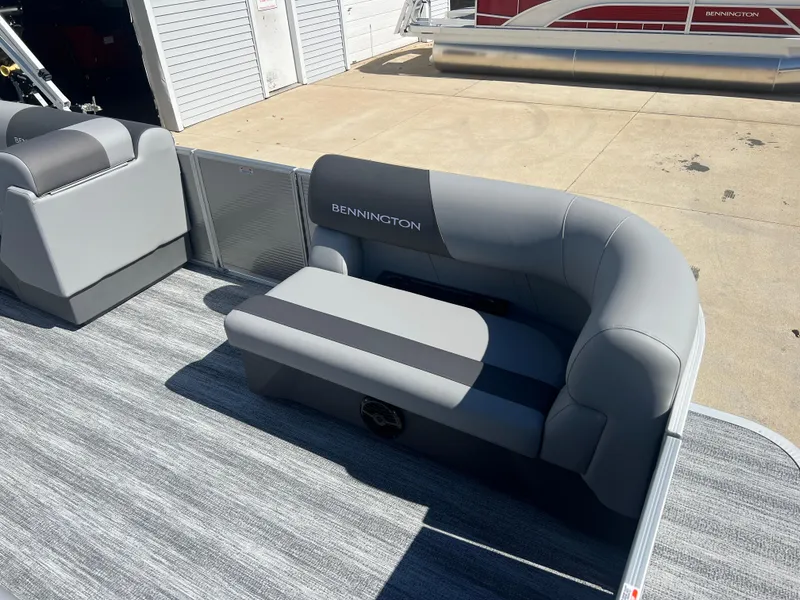 Slide: The Image of 2025 Bennington 20 SL pontoon boat with gray seating and modern design. - 10