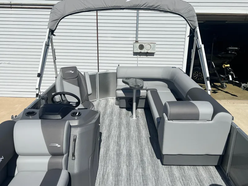 Slide: The Image of 2025 Bennington 20 SL pontoon boat with gray seating and canopy. - 12