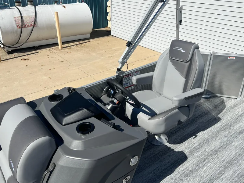 Slide: The Image of 2025 Bennington 20 SL boat interior with steering wheel and captain's chair. - 13