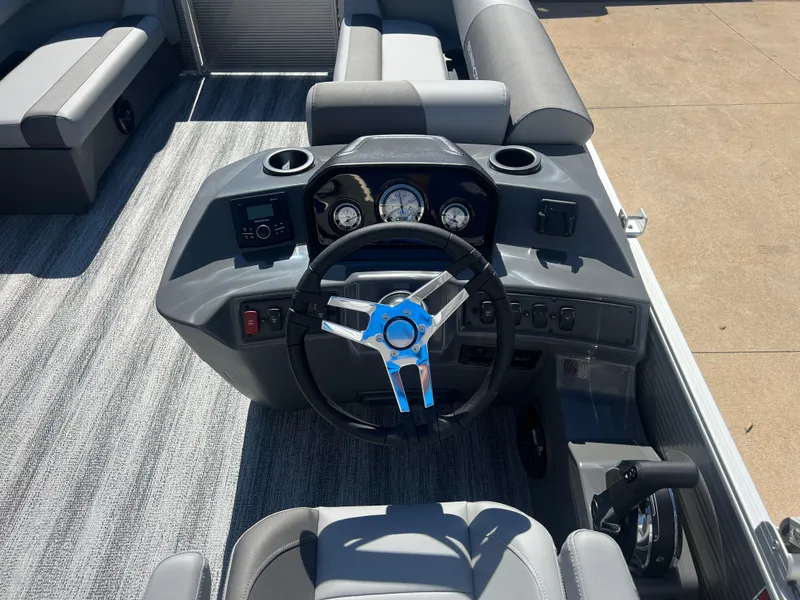 Slide: The Image of 2025 Bennington 20 SL boat dashboard with steering wheel and gauges. - 14