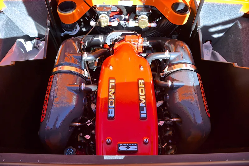 Slide: The Image of 2015 MasterCraft X23 Ilmor engine, vibrant orange and black design, high-performance marine motor. - 28