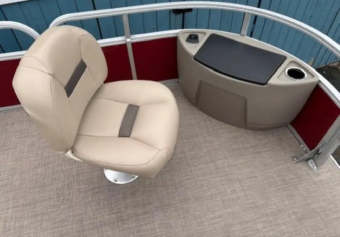 Slide: The Image of Sun Tracker Bass Buggy 18 DLX 2022 boat interior with beige seat and console. - 10