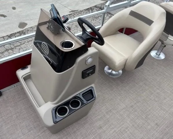 Slide: The Image of 2022 Sun Tracker Bass Buggy 18 DLX boat interior with steering console and seating. - 13
