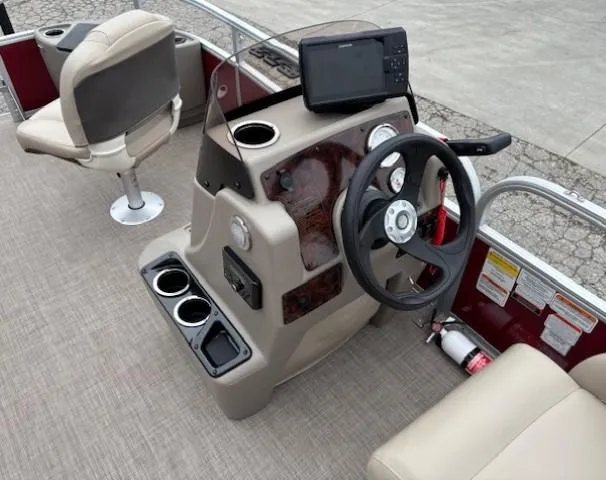 Slide: The Image of 2022 Sun Tracker Bass Buggy 18 DLX boat interior with steering console and seating. - 14