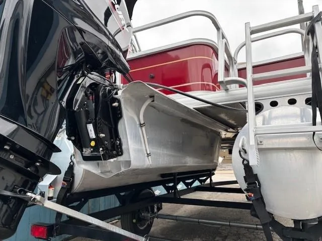 Slide: The Image of 2022 Sun Tracker Bass Buggy 18 DLX pontoon boat on trailer, rear view. - 17