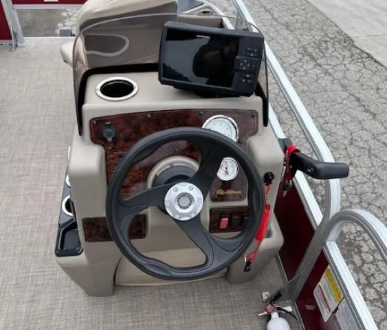 Slide: The Image of 2022 Sun Tracker Bass Buggy 18 DLX steering console with GPS and gauges. - 18