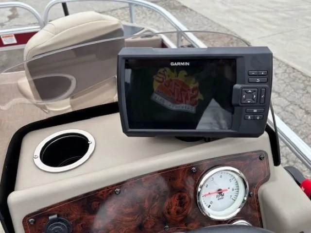 Slide: The Image of Dashboard of 2022 Sun Tracker Bass Buggy 18 DLX with Garmin GPS and speedometer. - 19