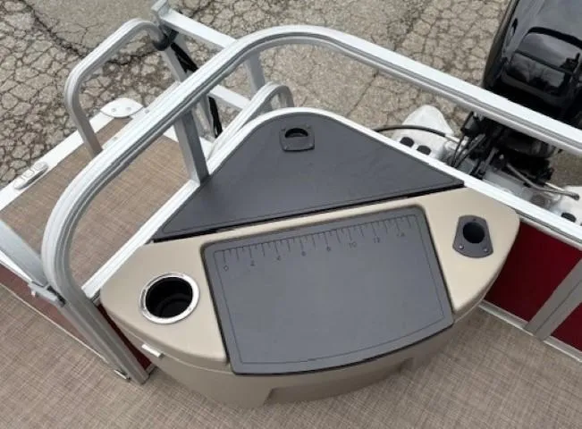 Slide: The Image of 2022 Sun Tracker Bass Buggy 18 DLX fishing station with cup holders and measuring board. - 26