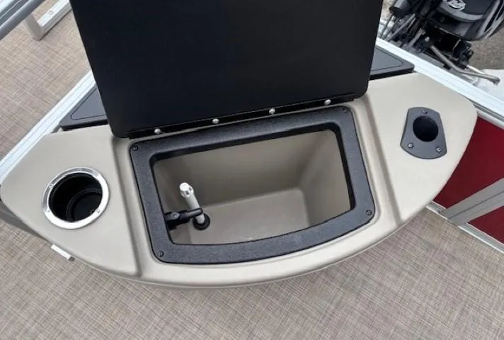 Slide: The Image of Sun Tracker Bass Buggy 18 DLX 2022 boat storage compartment with cup holders. - 27