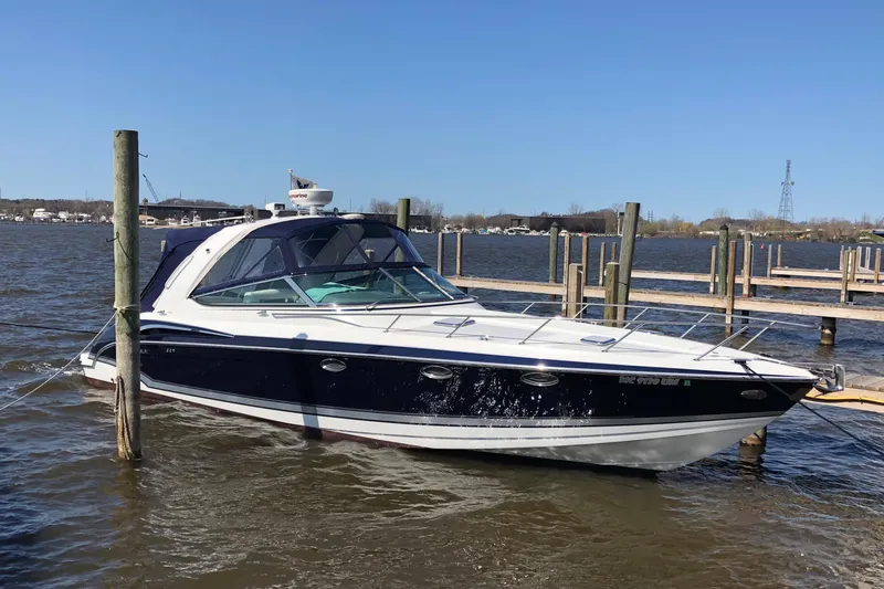 Slide: The Image of 2014 Formula 370 Super Sport boat docked on a sunny day. - 1