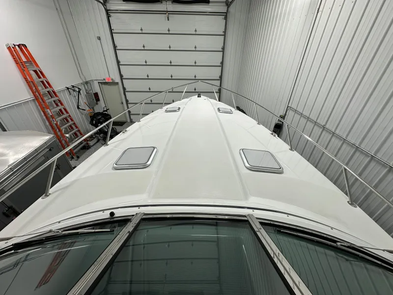 Slide: The Image of 2014 Formula 370 Super Sport boat in storage facility. - 14